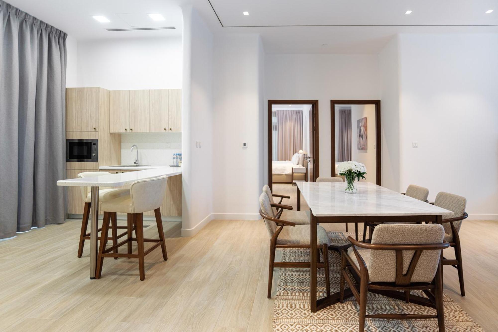 Mina Hotel And Residences By The Torch Ad Dawhah Esterno foto A typical apartment interior