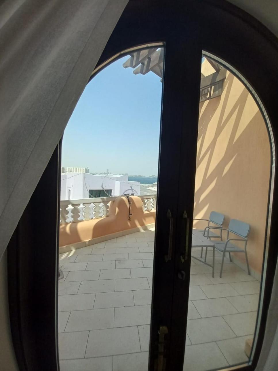 Mina Hotel And Residences By The Torch Ad Dawhah Esterno foto A view from the balcony of a suite at the hotel