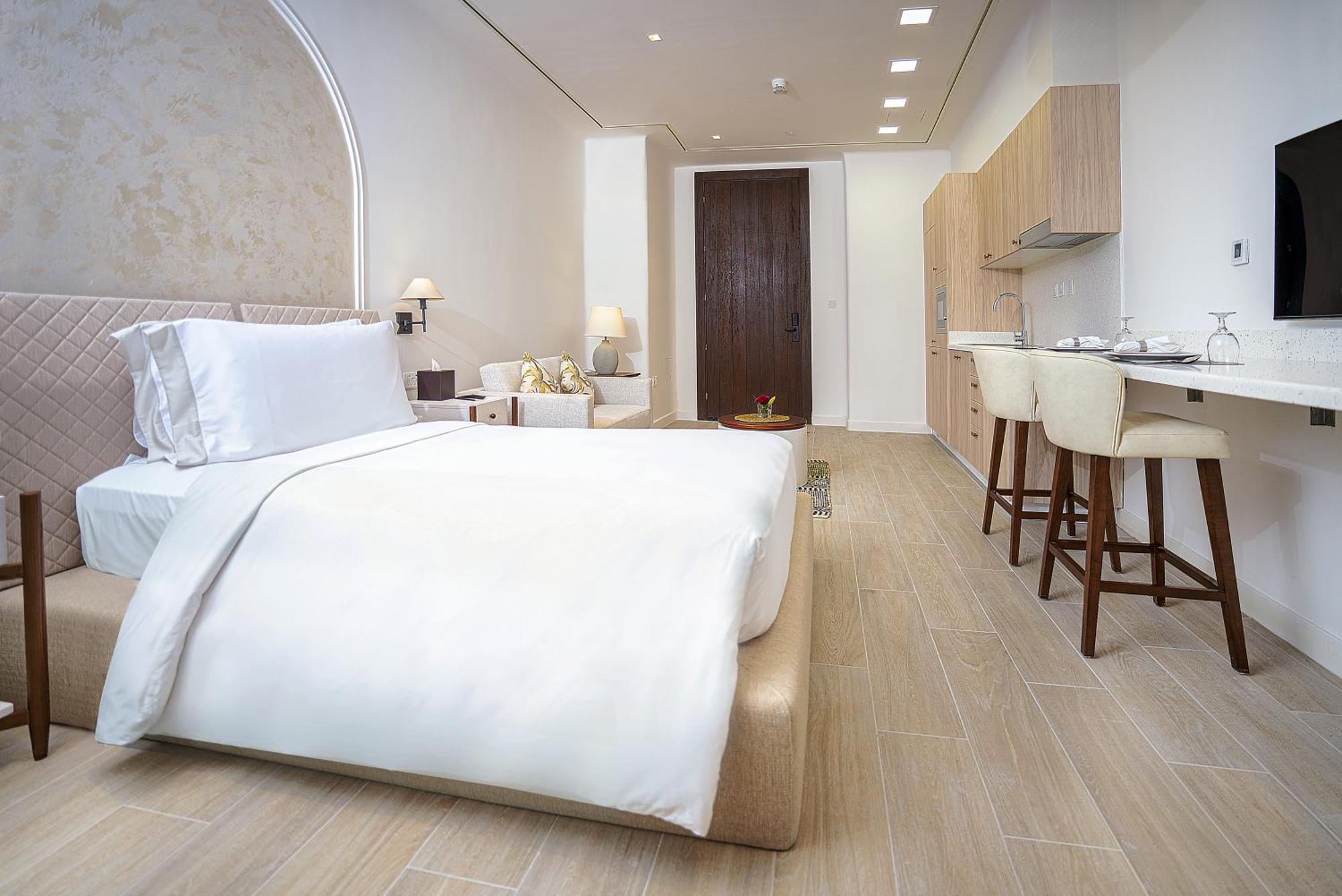 Mina Hotel And Residences By The Torch Ad Dawhah Esterno foto A bedroom at the hotel
